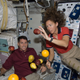 Astronauts Shane Kimbrough and Sandra Magnus, enjoy a rare treat with fresh fruit on the space shuttle (Image: NASA)